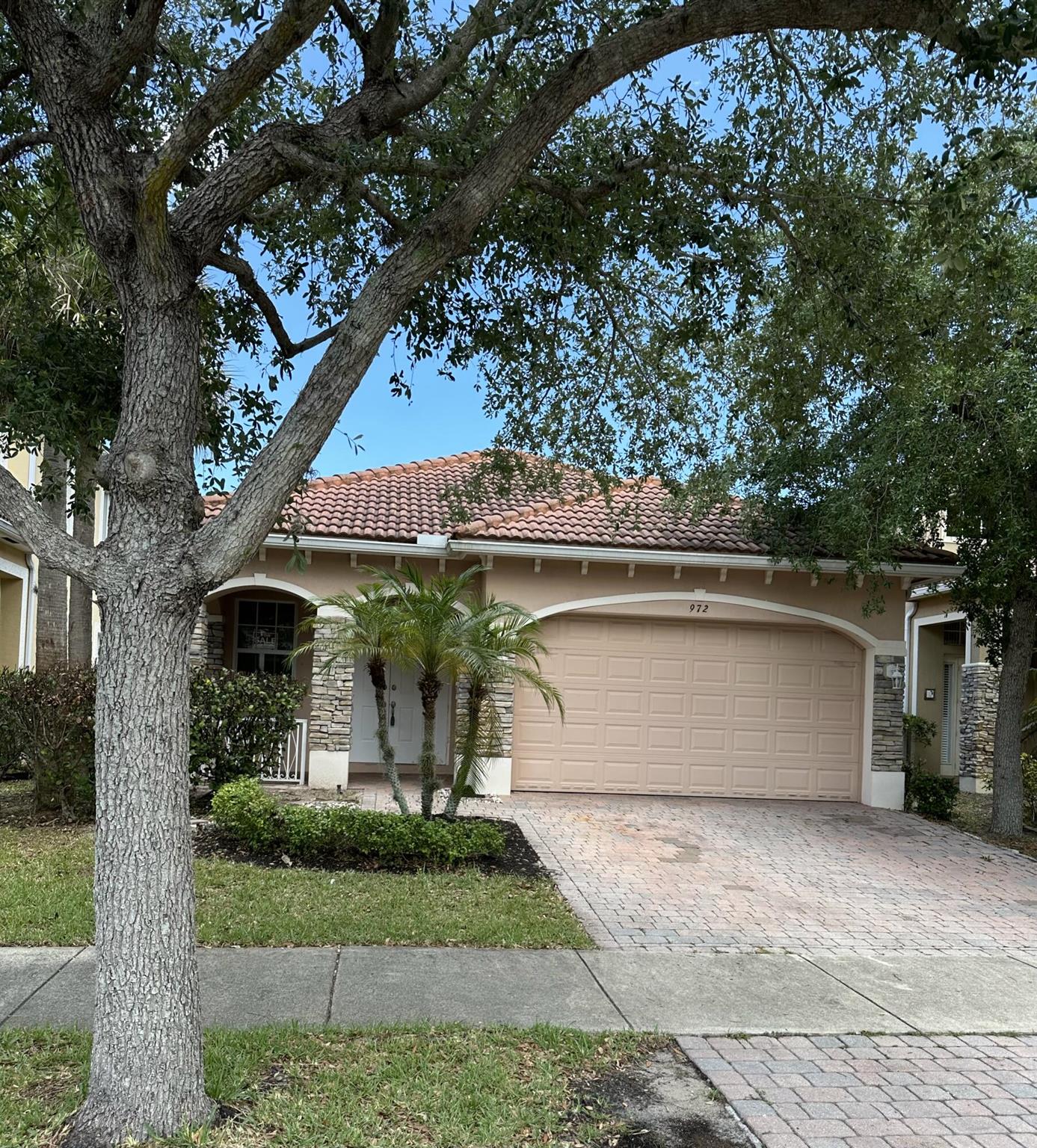 Located in the gated Vizcaya Falls community, 972 NW Leonardo Cir is a charming single-story home offering 3 bedrooms and 2 bathrooms within 1,628 sq ft of living space. Built in 2006, this CBS-constructed residence features an open floor plan with a spacious living room, dining area, and kitchen. The master suite includes dual sinks and a separate shower. Additional highlights include a 2-car attached garage, and inside laundry. The property sits on a 4,879 sq ft lot and is equipped with storm shutters for added protection. The HOA fee covers lawn care, trash removal, and access to community amenities such as a pool, clubhouse, and fitness center. This home is conveniently situated near shopping centers, schools, and the New York Mets' spring training center.