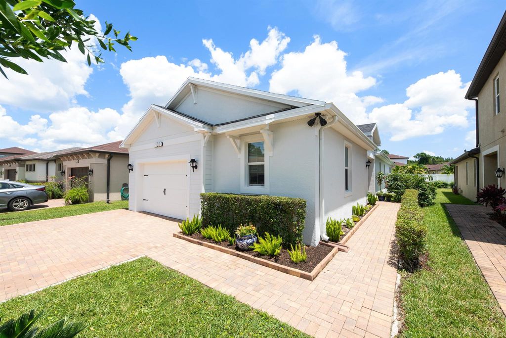Photo of 120 SE Via Visconti, Port Saint Lucie, FL 34952 (MLS # R10911333)