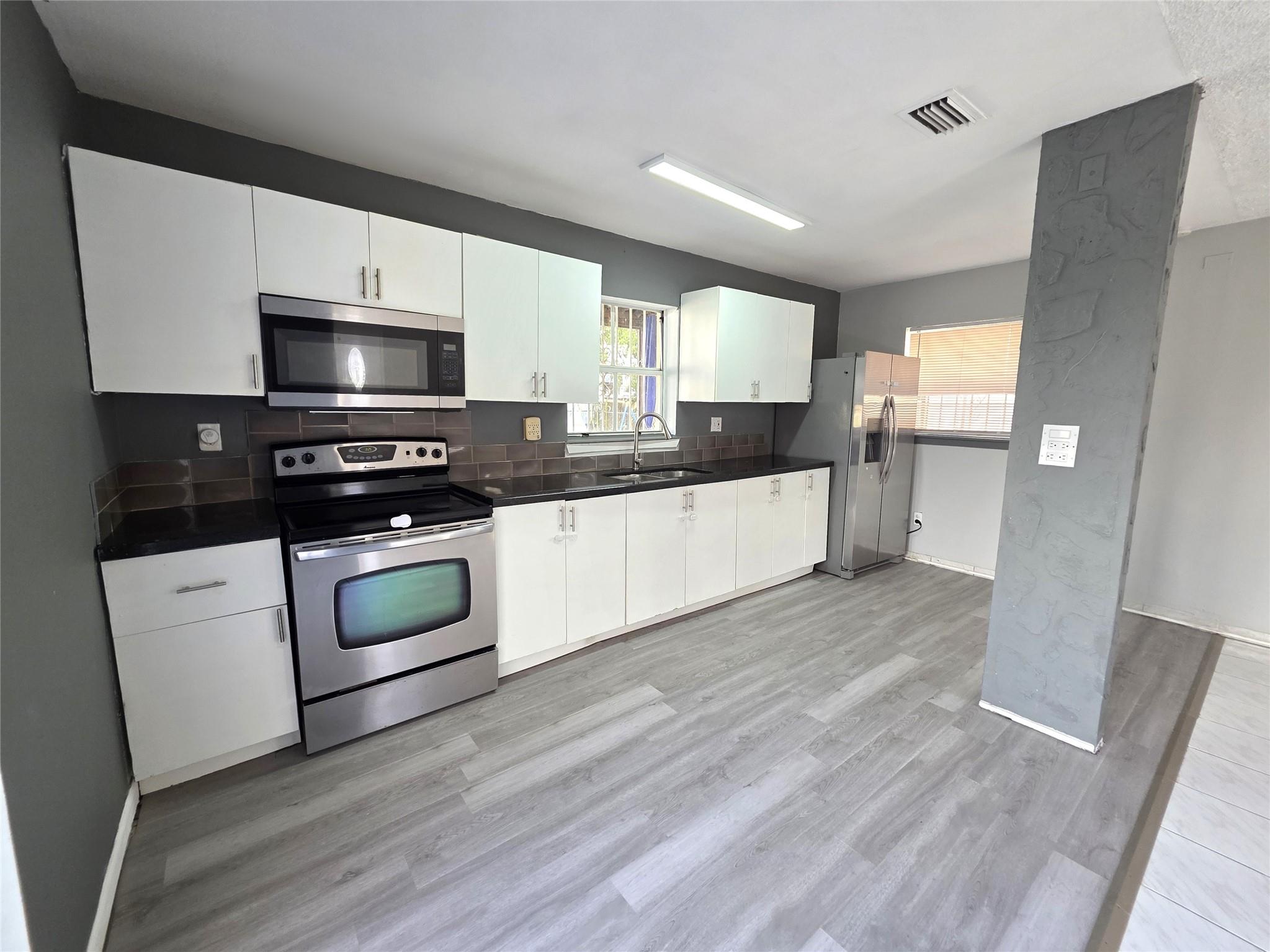 This beautifully renovated two-story home offers 3 spacious bedrooms and 2 full bathrooms upstairs, along with a convenient half bath on the main floor. The master bedroom features a private deck with lovely views of the yard and surrounding community. Enjoy a large backyard perfect for family gatherings and outdoor activities. Recent upgrades include fresh paint throughout and brand-new carpeting on the second floor. Located in a family-friendly neighborhood close to major highways and shopping centers, this move-in-ready home is ideal for creating lasting memories with your loved ones.