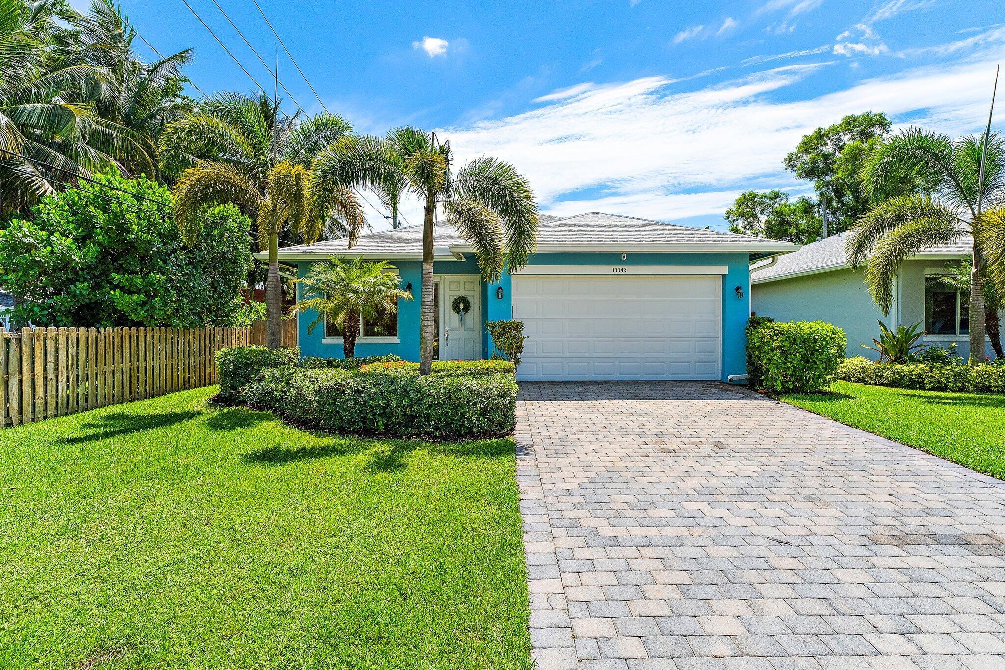 Debut Open House on Sat & Sun (7/19 & 7/20) from 1-3pm! Welcome to 17748 Evangeline Ave -- a corner-lot gem in one of Jupiter's most sought-after no-HOA neighborhoods. Built in 2020, this CBS home is packed with upgrades, including full impact windows and doors (plus an impact-rated garage door), and sits on a beautifully landscaped lot with thoughtful indoor-outdoor touches throughout.Step inside to discover soaring ceilings, 9-foot doors and tile flooring that flows seamlessly throughout the home. The kitchen is both stylish and functional, featuring quartz countertops, soft-close shaker cabinets and a new Samsung refrigerator, all overlooking a bright and open living area -- ideal for entertaining or everyday living.