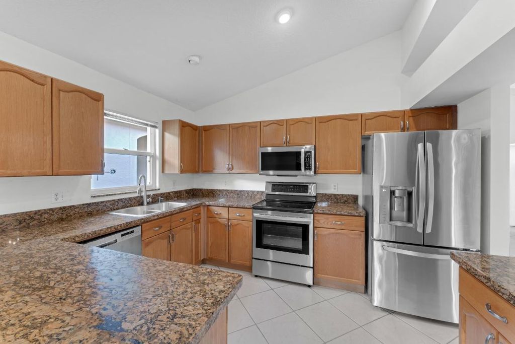 Photo of 2705 Pointe Circle, Greenacres, FL 33413 (MLS # R11137047)