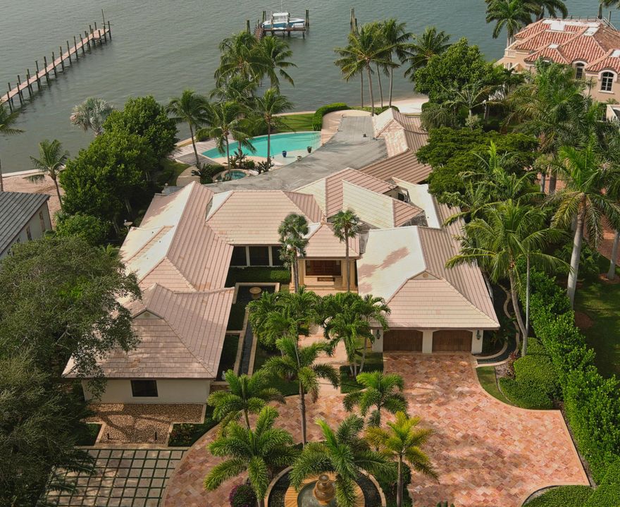 This home is on a 1.09 acre lot located in Lost Tree Village. Direct access to the ocean with no fixed bridges. The Palm Beach inlet is 4.5 miles away. 7,482 square feet with 5 bedrooms, 5.5 baths, family room and living room. The 125ft wide back yard has a pool, jacuzzi and a white sand beach off of Big Lake Worth.