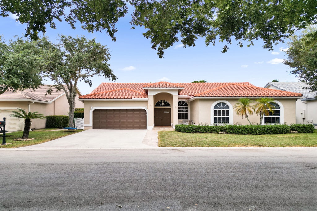Photo of 5351 NW 57th Terrace, Coral Springs, FL 33067 (MLS # B26040330)