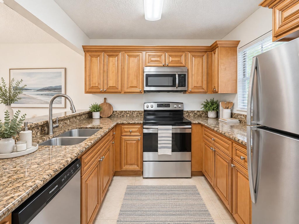 Photo of 1541 WINDORAH Way #E, West Palm Beach, FL 33411 (MLS # B26088745)