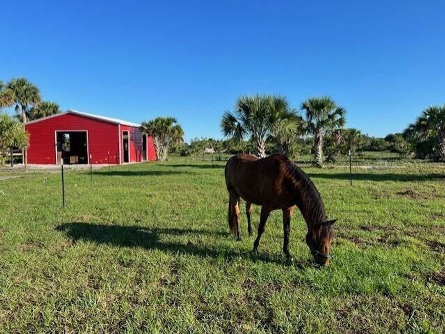 HAPPY HORSES WELCOME!  21 Acre Picturesque Equine Paradise:  Fall in LOVE as you enter, offering privacy and serenity.  Strategically cleared and sodded.  This pristine property is ready to build your new home.  Solar panel power, 1200 gallon Septic/drain field, well and water softener. 4 stall barn with motion fans, wash station, tack room and bathroom.  4 Paddocks and exercise round pen.  Lovely lighting around pond.  Fully fenced, electric gate entrance.  Grand Oaks & pines.  Wonderland of deer, rabbits, wild turkey, quail and native birds.  2023 Forest River RV not included, but is negotiable.  25 mins west of town.  Ideal for horse ownership, rescue/recovery center or equine camping site.  Miles and miles of trails.  This one has it all - created just for YOU!