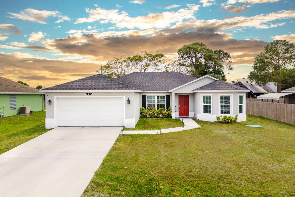 Photo of 950 SW Versailles Avenue, Port Saint Lucie, FL 34953 (MLS # R10796579)