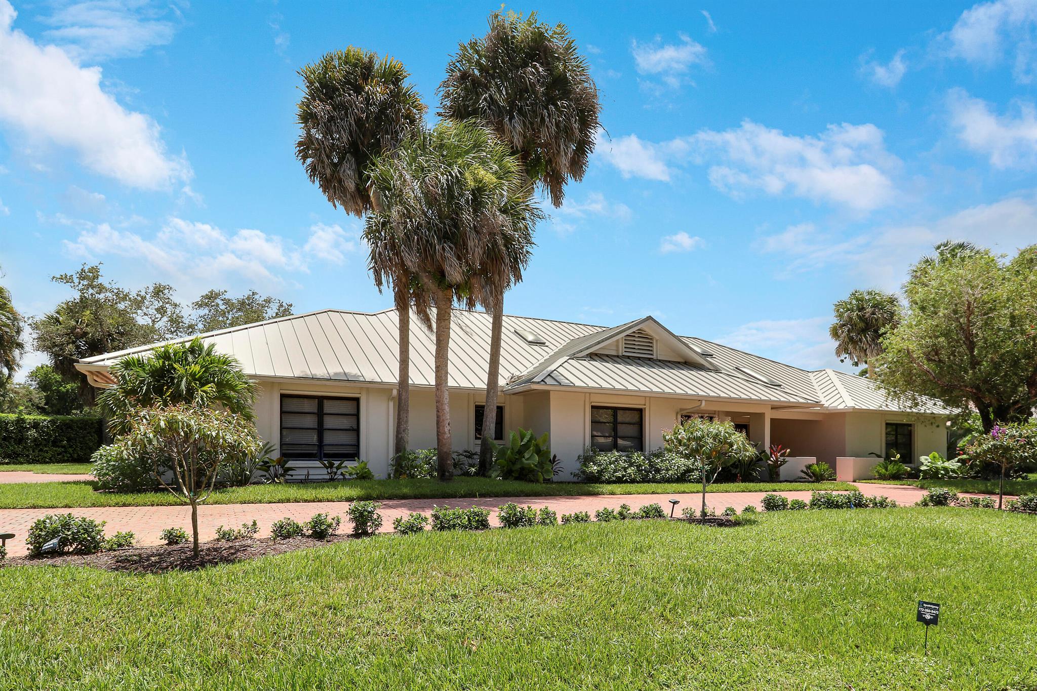 Available for the 2026/2027 season. Welcome to 5740 SE Winged Foot Dr, where refined living meets resort-style amenities in the coveted Mariner Sands community. This beautifully designed home offers over 3,500 sq ft of thoughtfully crafted space, featuring 3 spacious bedrooms, 3 full bathrooms, and a dedicated office ideal for remote work or quiet retreat. The expansive 3-car garage ensures ample room for vehicles and storage. At the heart of the home lies a stunning pool area with a fully equipped outdoor kitchen--perfect for entertaining or unwinding in private luxury. Reach out to Membership for opportunities on how to access to two championship golf courses, tennis and pickleball courts, a resort-style pool, state-of-the-art fitness center, and on-site dining options.