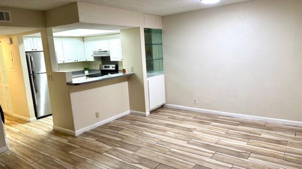 Photo of 1520 SE Royal Green Circle #107, Port Saint Lucie, FL 34952 (MLS # R11081279)