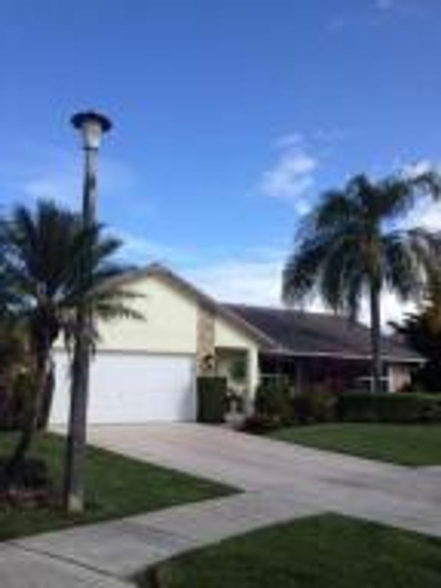 Lake View nicely updated split 4/2. Roof put on in 2007, New updated Kitchen Bathrooms, New A/C, impact Glass Window's, Cherry Wood Floors, Wood Blinds, Newer water heater, Crown Moldings. Perfect Florida Lifestyle on wide lake with awesome bird watching. Your lawn is even watered by lake behind house so your water bills are very low.  Community has new exercise facility and community pool with BBQ and family area. All schools A rated.