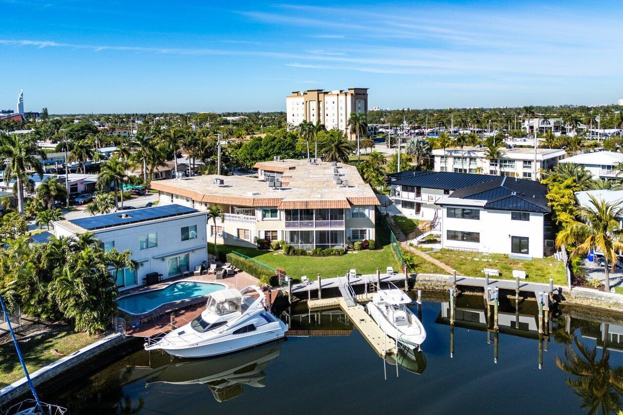 1 bedroom 1.5 bathroom private corner unit with stunning ocean-access water views. The BEST views in the building. Located in sought after Pompano Beach just east of Federal Hwy. This updated unit boasts an open kitchen with granite countertops and wood cabinets, while the spacious bathrooms have been tastefully updated. Tile floors throughout. Beautifully furnished with a tropical feel. Serene screened in patio. Ground Floor unit with full hurricane protection and extra storage. This pet-friendly community has had recent upgrades, including a newer roof, dock, and 50-year inspection. Dock, jet ski, and kayak space when available. No fixed bridges. Situated in a multi-million-dollar neighborhood, minutes from top shopping, dining, beaches, parks, golf, and fitness centers.