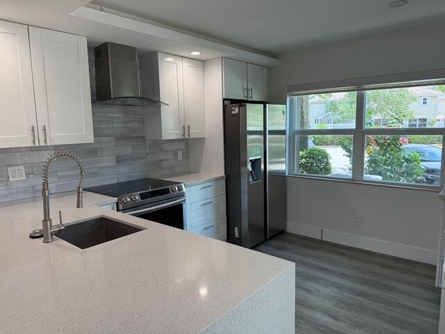 Remodeled beautiful townhouse in the 24-hour manned gated community of Wellesley in Boynton Beach. This townhouse has all impact rated windows in addition to accordion shutters for added safety and security. 2 large bedrooms with en-suite bathrooms and half bath downstairs. Completely renovated kitchen with custom soffit and new floors throughout. Large covered/screened-in private front patio area as well. Landlord willing to provide high speed ATT fiber internet.