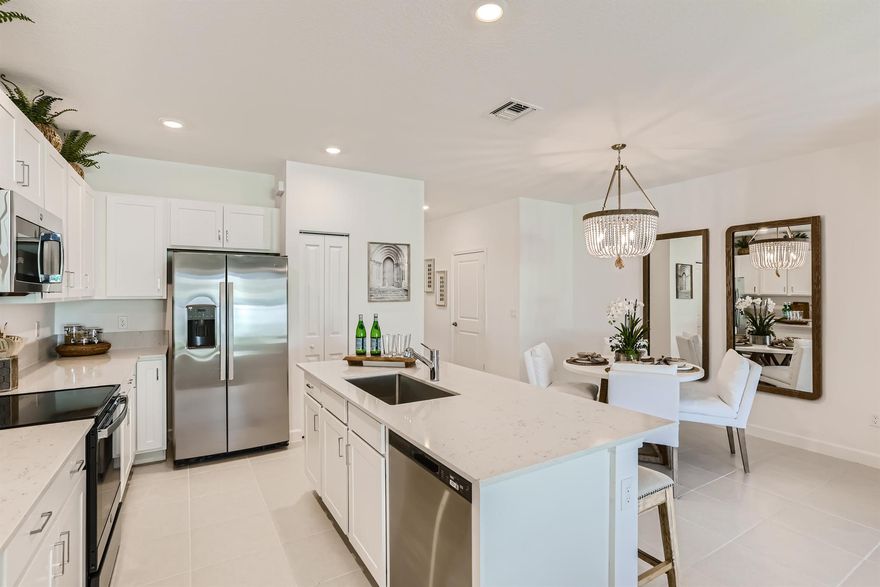 This two-story townhome showcases a contemporary open design among the first-floor kitchen, dining room and living room to promote seamless transitions between spaces. Through sliding glass doors is a terrace for outdoor relaxation. Upstairs caters to all three bedrooms, including the spacious owner's suite complemented by an adjoining bathroom and oversized walk-in closet. Photos are for illustrative purposes only.