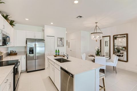 Photo of 822 SE Grovebush Lane, Port St Lucie, FL 34984 (MLS # R11136959)