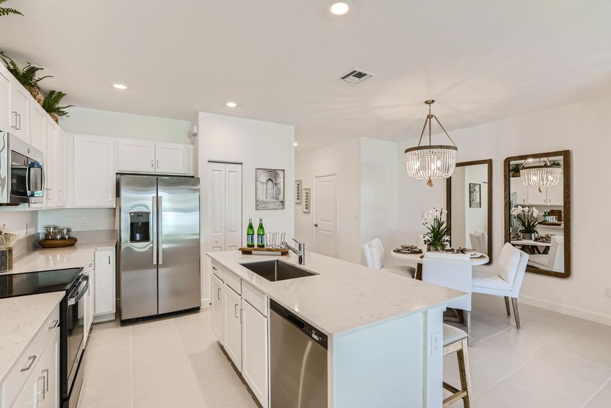 This two-story townhome showcases a contemporary open design among the first-floor kitchen, dining room and living room to promote seamless transitions between spaces. Through sliding glass doors is a terrace for outdoor relaxation. Upstairs caters to all three bedrooms, including the spacious owner's suite complemented by an adjoining bathroom and oversized walk-in closet. Photos are for illustrative purposes only.