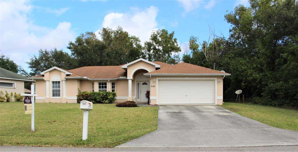 Photo of 3162 SW Ann Arbor Road, Port Saint Lucie, FL 34953 (MLS # R10777560)