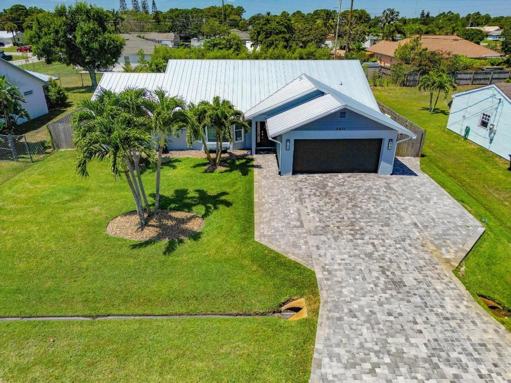 Photo of 2211 SE Mandrake Circle, Port Saint Lucie, FL 34952 (MLS # R10986864)