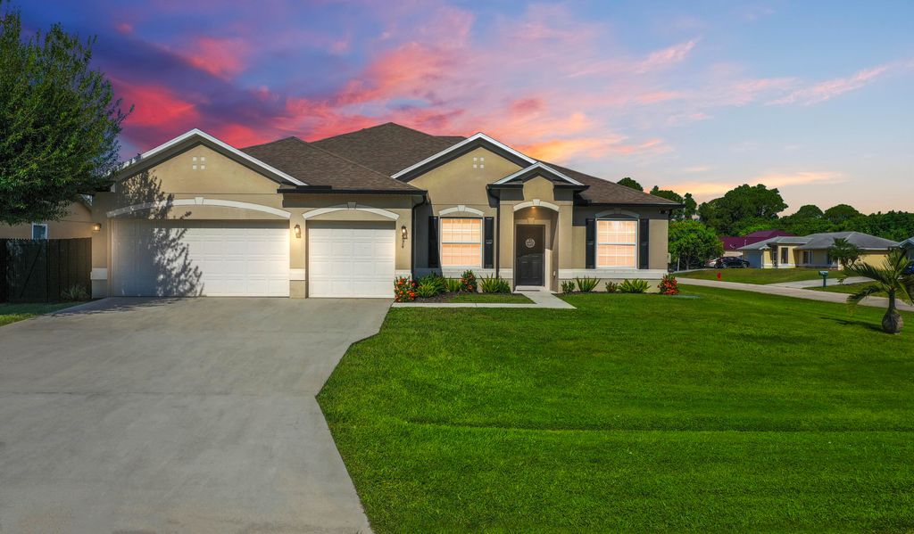 Photo of 4074 SW Kamsler Street, Port Saint Lucie, FL 34953 (MLS # R11129432)