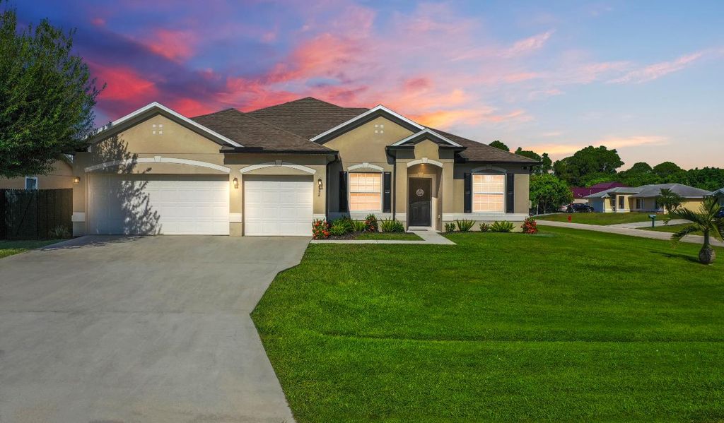 Photo of 4074 SW Kamsler Street, Port Saint Lucie, FL 34953 (MLS # R11129432)