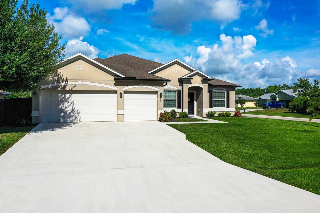 Photo of 4074 SW Kamsler Street, Port Saint Lucie, FL 34953 (MLS # R11129432)