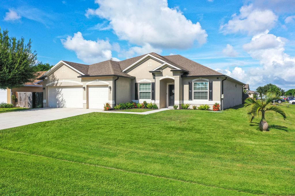 Photo of 4074 SW Kamsler Street, Port Saint Lucie, FL 34953 (MLS # R11129432)