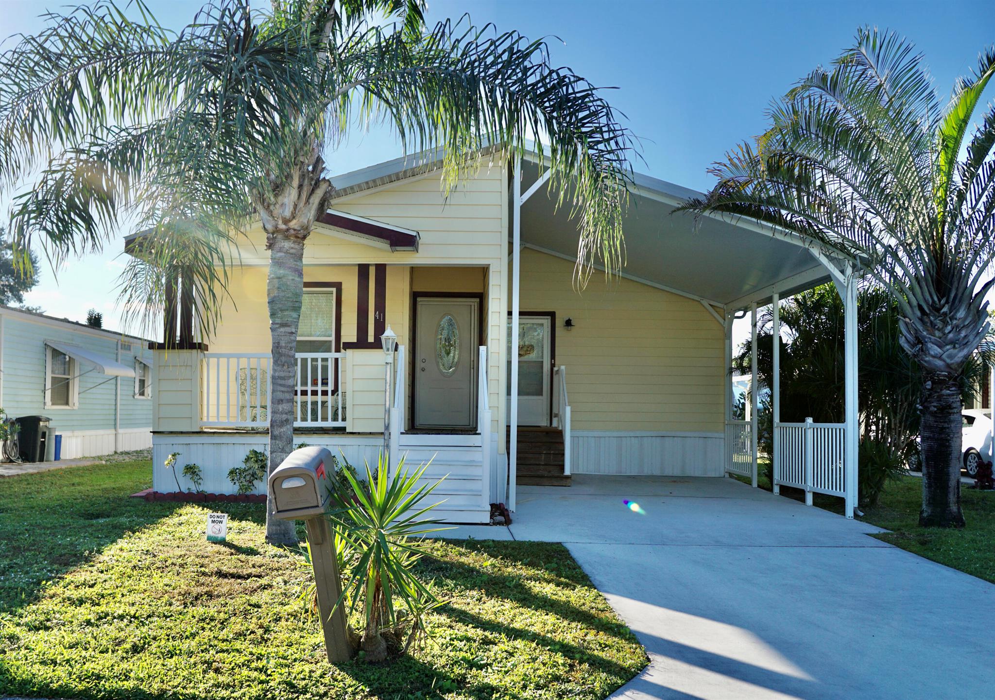 PET SECTION home in the highly sought-after Spanish Lakes Golf Community. Offering a carefree, resort-like lifestyle, this beautifully furnished 2-bedroom, 2-bath home (plus a den/office) is move-in ready, turn key! Soak up the Florida sunshine on either of the two porches. Inside, you'll find high-end furnishings, an inviting layout, and all the comforts of home. NEW HW heater & dishwasher. Located in a 55+ community, Spanish Lakes offers a relaxed and vibrant lifestyle, featuring FREE GOLF, social activities, swimming, fitness, tennis, billiards and more. This is a land-leased home, and park approval is required for purchase. Pay NO PROPERTY TAXES and NO HOA as your $899.25 land lease pays it all, including lawn care & trash removal giving you time to enjoy life. Call today!