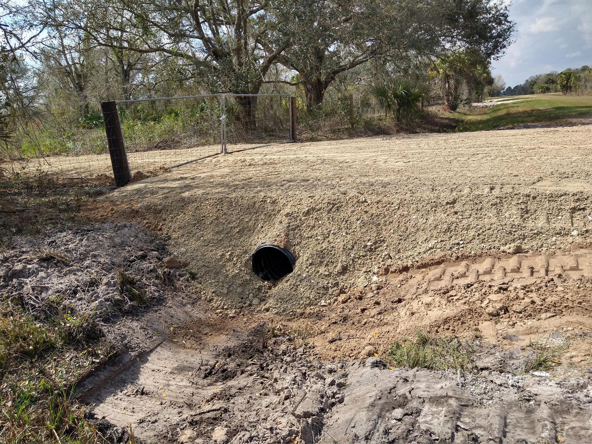 1.5 Acre lot, Partially Cleared in Center, 3rd Lot from paved rd. New Culvert & 25' Driveway. Fully Fenced with Two 10' Gates. Property has several mature Oak trees, Palm trees and Maples. Single family homes, double wide mobile homes of 1000sqft or larger are permitted. (Barndominiums may be permitted Please Verify this before purchase). Approximately 20 minutes from the City of Okeechobee, 5 minutes from Kissimmee Prairie Preserve State Park. Listing Realtor is Related to the Seller