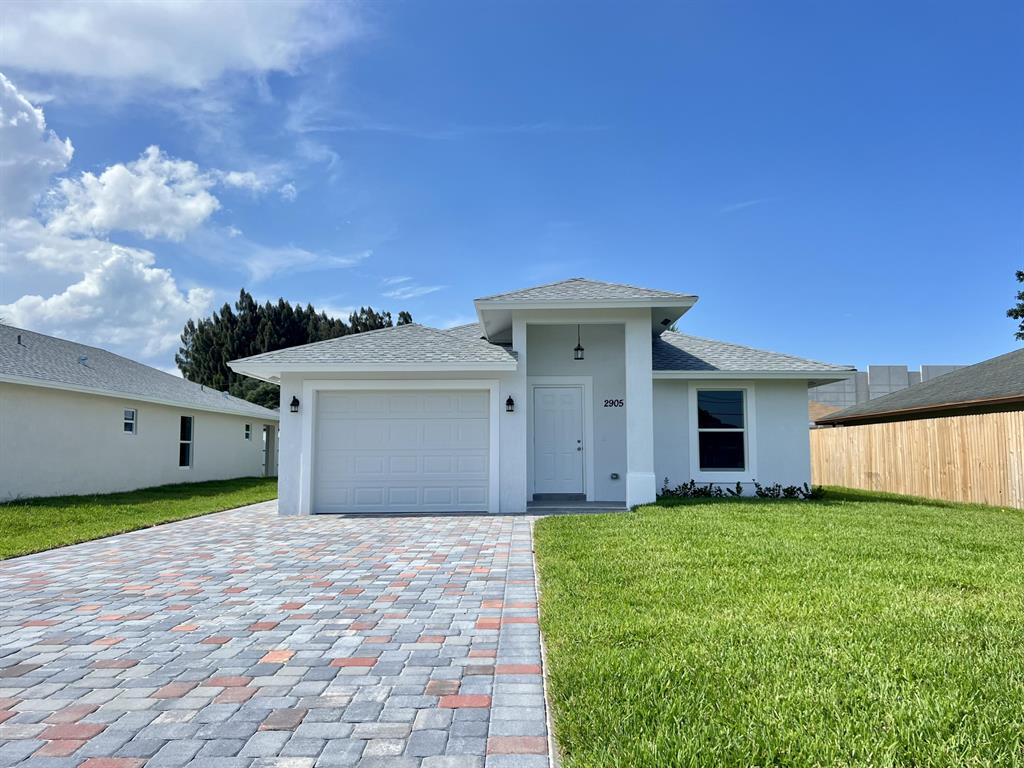 Welcome to your DREAM HOUSE! Gorgeous single family residence located in the heart of West Palm Beach. This property boasts an open, spacious, modern and bright living area and kitchen with wood cabinetry, quartz countertops, and brand new stainless steel appliances. The house also features porcelain tile floors, impact glass doors and windows, dome ceilings, walk-in closets, dual sink vanity and shower in master bathroom, glass shower/tub doors, extensive driveway, fenced backyard, and rear porch. Make this beautiful house yours today!