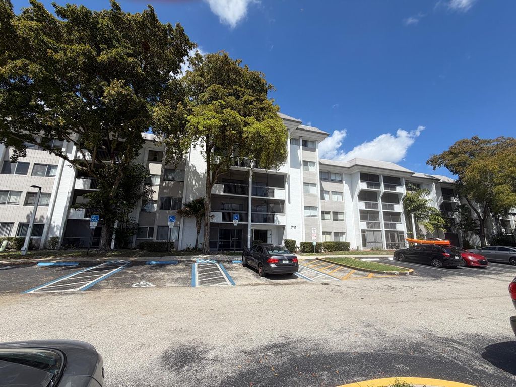 Photo of 711 N Pine Island Road #104, Plantation, FL 33324 (MLS # B26002956)
