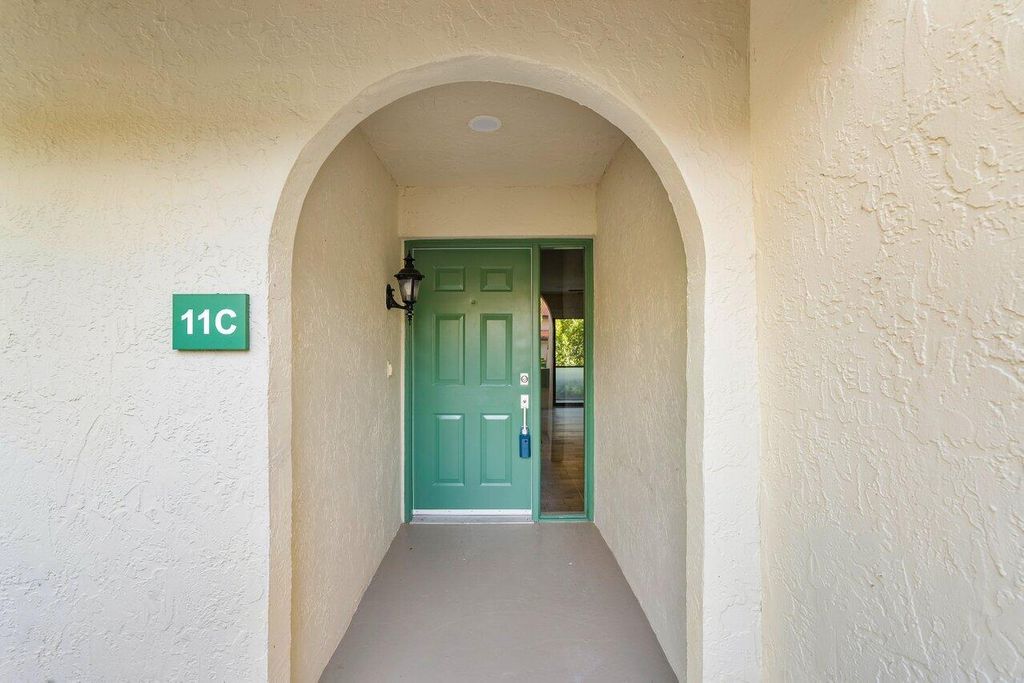 Photo of 11 Lexington Lane E #C, Palm Beach Gardens, FL 33418 (MLS # R11065395)