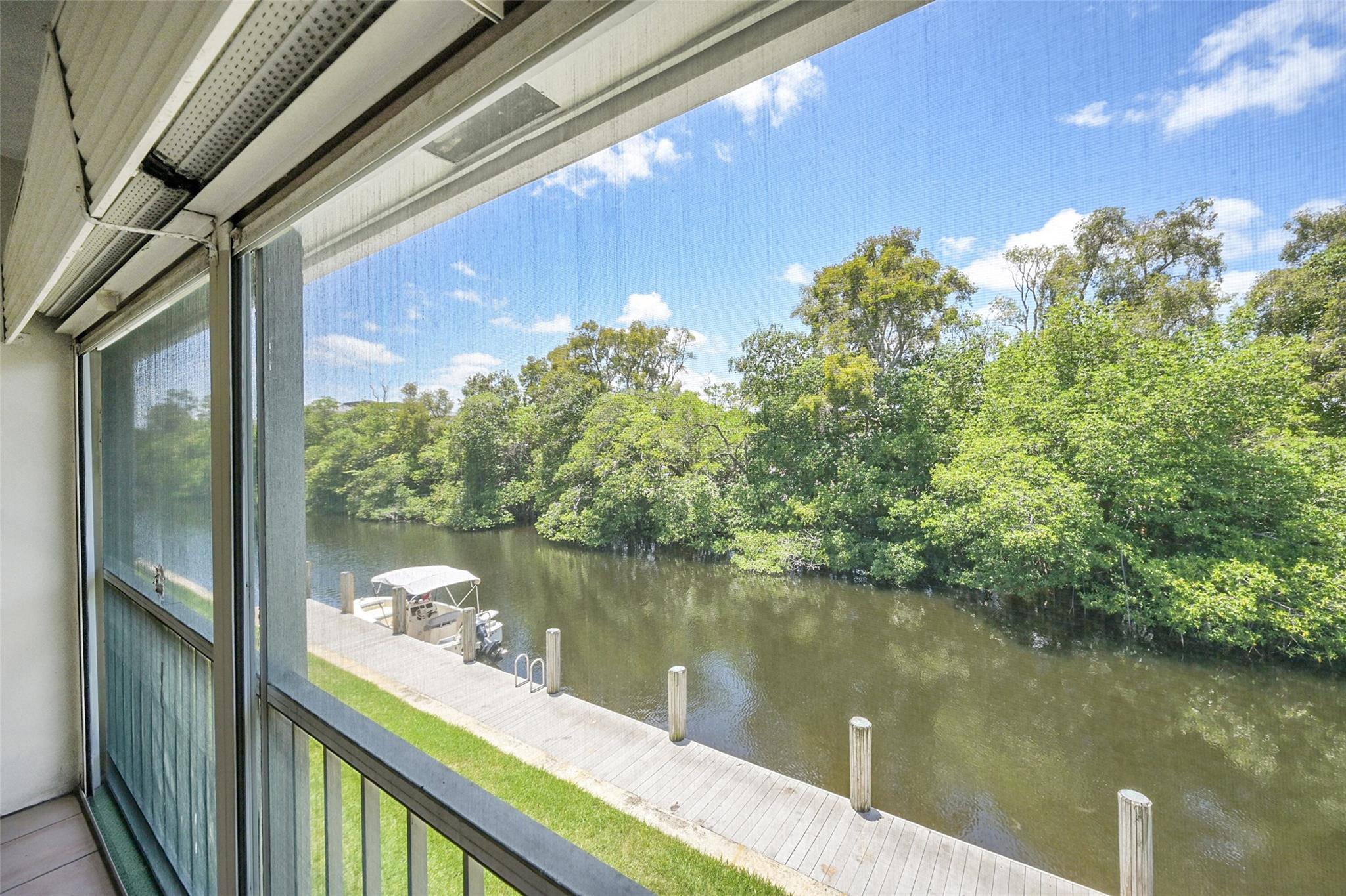 Remodeled canal-front 2-bedroom, 2-bath condo located in the sought-after Cypress Anchorage community. Enjoy serene water views from your spacious private patio, perfect for relaxing or entertaining. Living areas are fully tiled, with laminate flooring in both bedrooms. The kitchen features granite countertops and warm honey-toned cabinetry. This charming unit comes with a new roof, no current assessments, and an assigned parking space. The building offers boat/ jet ski docking and comes with a storage unit for owners. Just a short drive to the beach! With reasonable maintenance fees and a prime location near shopping and dining, this is a perfect opportunity for first-time buyers, snowbirds, or those looking to downsize. The owner says sell and we can’t wait to show it to you!