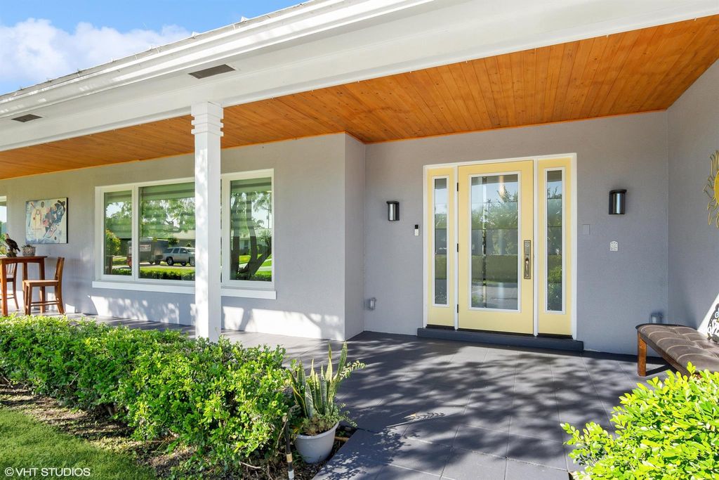 Photo of 285 N Country Club Drive, Atlantis, FL 33462 (MLS # R10928243)