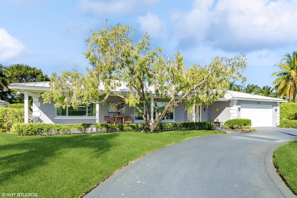 Photo of 285 N Country Club Drive, Atlantis, FL 33462 (MLS # R10928243)