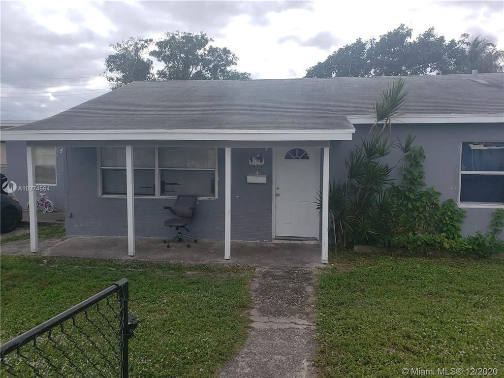 Photo of 1417 W 32nd Street, Riviera Beach, FL 33404 (MLS # B26036907)