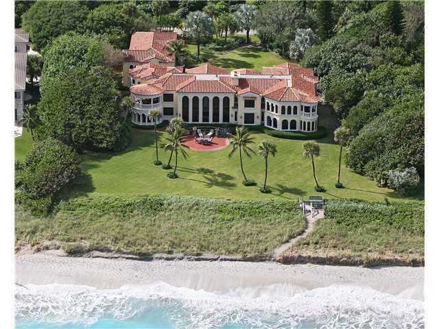 A truly amazing custom built oceanfront estate on over 1.5 acres of lush tropical landscaping with 187' of beautiful sand beach. Wine cellar, wood carved bar, elevator, second floor dining room with expansive ocean views and outdoor seating, fitness room, two fireplaces, drenched in marble, vaulted ceilings, three car garage, 5B/5B detached guest house. 48 hour notice for showings please. Facial masks will be required.
