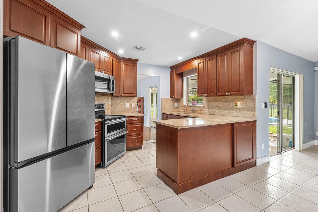 Photo of 206 Parkwood Drive S, Royal Palm Beach, FL 33411 (MLS # B26027365)