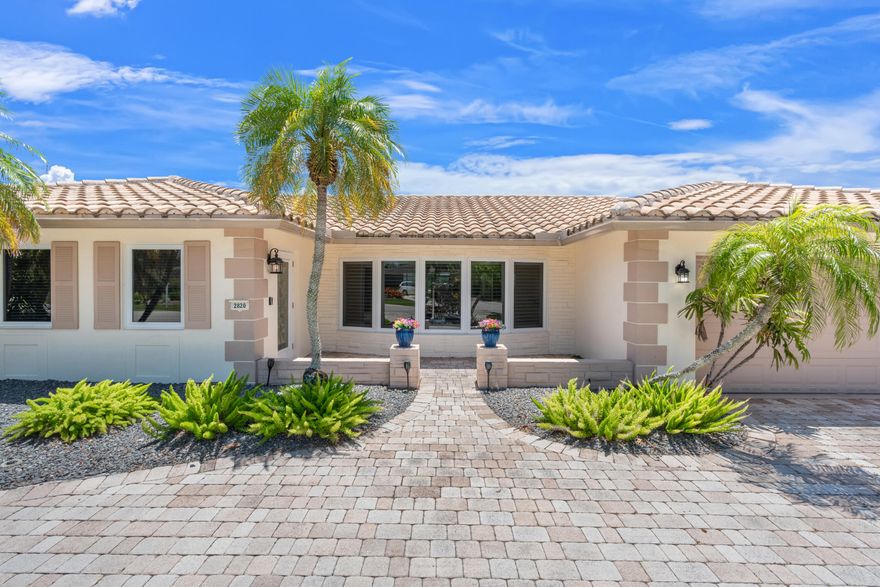 Boater's paradise with 75 feet of waterfront on a 100-foot-wide canal and a new seawall/dock completed to current code in 2020. This welcoming 3-bedroom, 2-bath home features porcelain tile throughout, including a cabana bath ideal for pool access. Top-of-the-line PGT impact windows and pocket sliding glass doors provide abundant natural light and seamless indoor-outdoor living. Interior features include plantation shutters and custom window coverings. The spacious south-facing patio area offers a private backyard setting with a pool and custom built-in infrared gas grill, perfect for entertaining. Additional upgrades include over $60K in solar panels, oversized 2-car garage with impact garage door, beautifully landscaped front yard with sprinklers & a low-maintenance astro-turf backyard.