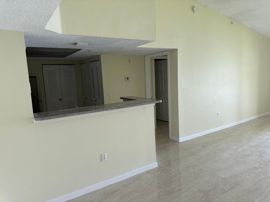 Welcome to this stunning Lakeview corner unit on the second floor—featuring soaring vaulted ceilings and a spacious 2-bed, 2-bath split floor plan. Freshly painted. With new porcelain and tile flooring throughout, a separate laundry area with full-size, newer washer/dryer, and a master bedroom with a walk-in closet, this home blends style and practicality. Every room showcases breathtaking lake views, creating a serene retreat.
Located in a gated community with all amenities, it’s ideally situated near Coconut Creek schools, major highways, the Promenade, and Coconut Creek Casino. Professionally managed for hassle-free living.