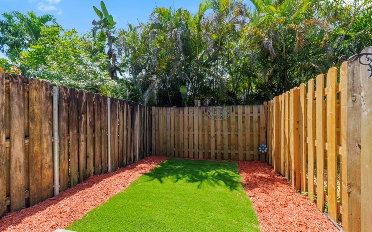 Prime Location Rental! Just minutes from the Hard Rock Casino, NSU, shopping, and dining. This two-story home comes furnished and features impact windows and doors. Enjoy a fenced backyard with turf—perfect for pets—and the convenience of an in-unit washer and dryer. Available now for $2,200/month. RAPID APPROVAL.