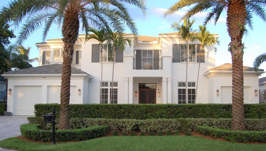 Absolutely magnificent custom home in Royal Palm Yacht & Country Club W/5 Bedroom,5 1/2 Bathrooms plus large Den/Office and 2 Laundry Rooms. This stunning home includes an open gourmet kitchen flowing into the family room and breakfast area with twin sub zero fridge/freezers, Wolf 6 burner range and warming drawer and a large stone center island. The Butlers Pantry includes a wine cooler, dishwasher, and Sub Zero refrigerator drawers and a sink. Walk into the main living areas through the grand foyer with a breathtaking chandelier leading to the formal living and dining spaces with a fireplace. The Primary Suite is located on the first floor with his and hers walk-in closets. Ascend the gorgeous staircase with regal bannisters or take the Elevator to 4 additional bedrooms (two bedrooms are junior suites), a laundry room, and a spacious loft area. Enjoy the ocean breezes from the balconies upstairs. Additional features include a covered lanai with summer kitchen overlooking the heated pool and spa, lush landscaping and privacy.