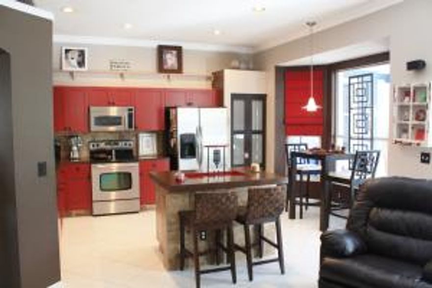 Spectacular three bedroom, two bath home with a two car garage right down the road from Boynton Beach's restaurants and shops! This home is open and spacious with lots of windows for plenty of natural light. Crown molding and tile throughout! The living room is open to the kitchen providing a spacious floor plan. The dining area sits right off the kitchen and the eat-in breakfast area overlooks the sunroom. The kitchen is completely updated with beautiful touches, stainless steel appliances and an island for extra counter space! All three bedrooms are bright and spacious. The master bathroom has a bath tub and separate shower. The sunroom is huge with floor to ceiling impact windows facing the back yard and sits off the living room and kitchen.