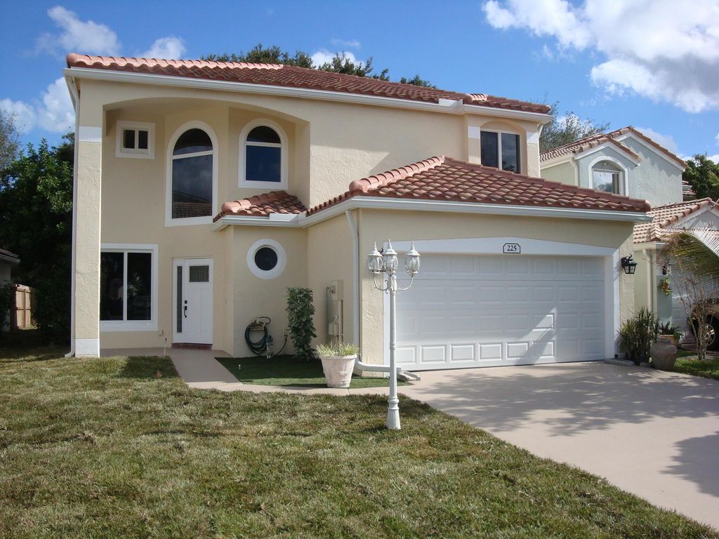 Photo of 225 Maplewood Lane, Greenacres, FL 33463 (MLS # R11133051)