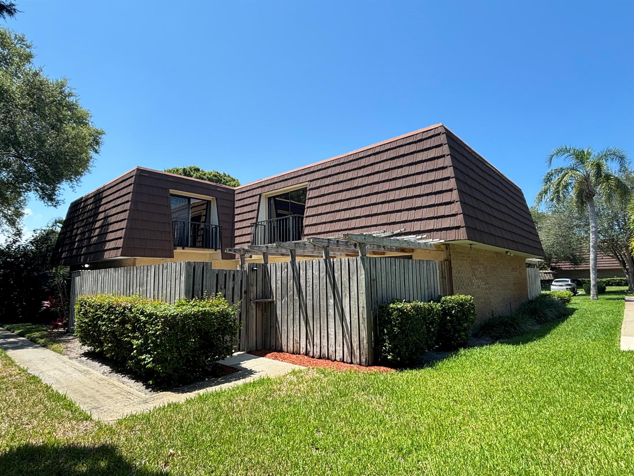 Very nice 2 bedroom 2.5 bathroom + den townhouse with court yard perfect for a BBQ and entertaining, Tile and Laminate floors throughout, in a most desirable community of GARDEN LAKES of Palm Beach Gardens. Features two bedrooms on upper level which include private balconies and walk-in closets. 3rd room located on first floor could be additional bedroom, den or office. The community offers tennis courts, pickleball court, squash ball court , basketball, bike/jogging paths, picnic area and playground. lots of open green spaces and lakes . Two assigned spaces, but no trucks, motorcycles or commercial vehicles allowed. Within walking distance to shopping centers, restaurants, entertainment and Downtown at the Gardens and Palm Beach Gardens Mall.