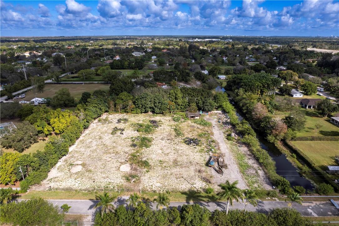 Rare opportunity to own 2.5 acres in highly sought out and exclusive Southwest Ranches. Location offers privacy, surrounded by Million dollar homes, and easy access to Griffin Road. ZONED A-1 WITH MANY DIFFERENT TYPES OF USES. Take advantage of this unique opportunity to own and design your own estate surrounded by Million dollar homes and A+ rated schools. This is your opportunity to Build your Dream Home on this 2.5 Acre Lot in Beautiful Southwest Ranches Florida. The property has a Canal and a Traffic Barrier on the street to prevent local traffic from coming in from adjacent community. Lot will be cleared of any equipment and/or debris.