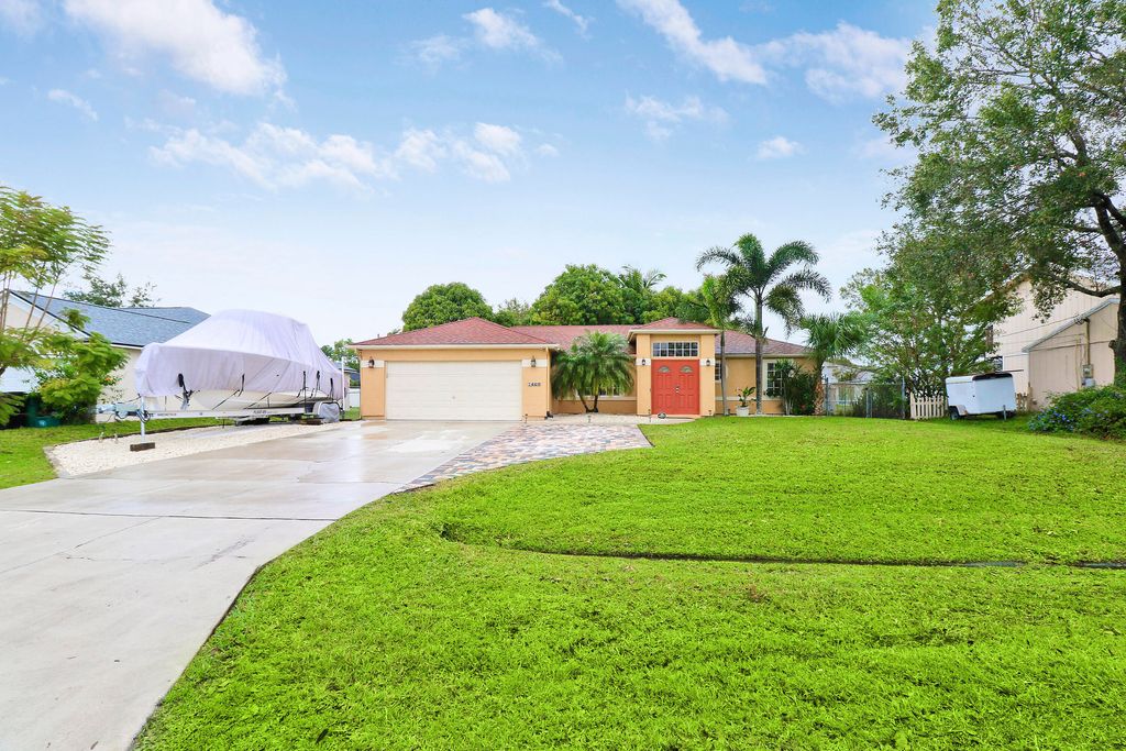 Photo of 1469 SW Leisure Lane, Port Saint Lucie, FL 34953 (MLS # R10943224)