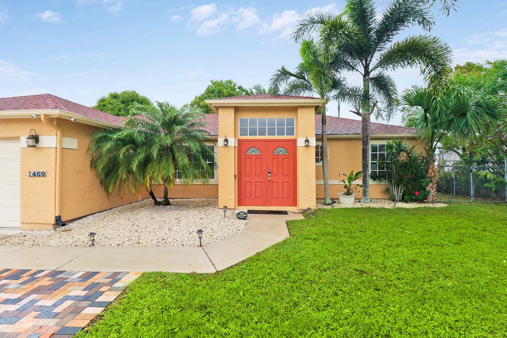 Photo of 1469 SW Leisure Lane, Port Saint Lucie, FL 34953 (MLS # R10943224)