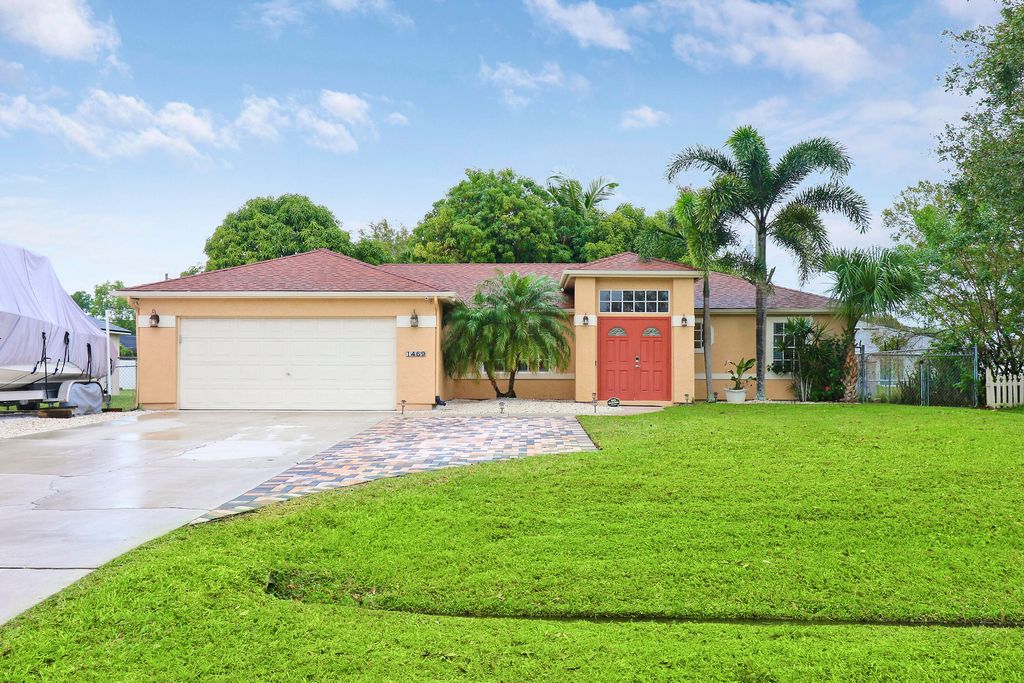 Photo of 1469 SW Leisure Lane, Port Saint Lucie, FL 34953 (MLS # R10943224)