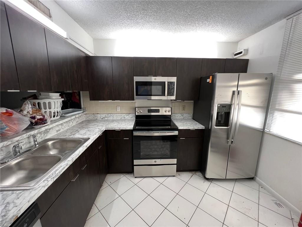 Photo of 3650 Whitehall Dr #105, West Palm Beach, FL 33401 (MLS # F10317451)