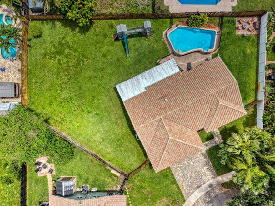 Welcome home to one of the largest lots in the desirable Forest Lake community. This beautifully maintained 4-bedroom, 2 bath residence features a split floor plan. Home features hurricane impact windows/doors, a newer roof, newer A/C, an upgraded kitchen with granite countertops, and stainless-steel appliances. Both bathrooms have been tastefully updated. Step outside to your private backyard oasis with a sparkling pool safety gate. The oversized screened in patio is perfect for entertaining or relaxing evenings. A new sprinkler system with a brand-new pump/timer and the playground set conveys with the sale. The home is fully wired for a camera system (cameras excluded). Located near A+ rated schools