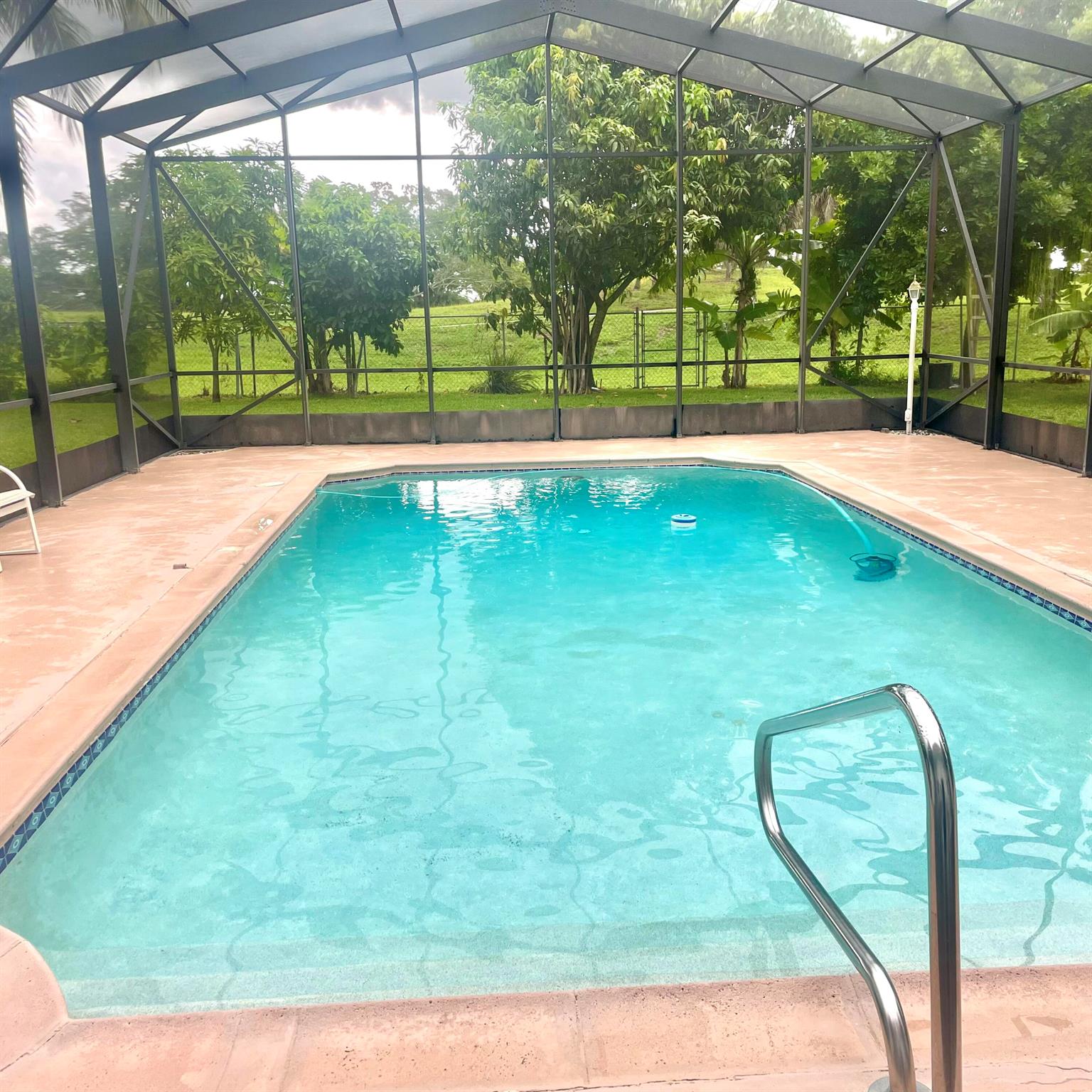 Stunning 2BR, 1BTH home w/large screened-in pool area & large backyard. Prime location, friendly neighborhood, close to top rated schools & shopping. This beautifully maintained home combines modern comfort & luxury. The screened-in pool area is perfect for year-round swimming, exercise, and relaxation, outdoor dining, rain or shine. Landscaped & fenced for privacy and safety. Enjoy fresh citrus with mature fruit trees right in your own yard. Convenient location to shopping. Kitchen features contemporary fully furnished & laundry area, energy efficient windows & lighting. This well maintained home includes a 2 car garage.