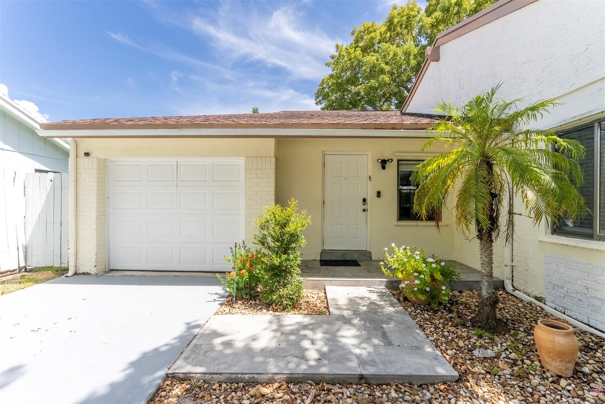 Light, airy, beautiful and bright, come and live the Boca life! Charming home with low HOA fees! Large one car garage with loads of storage! Near A and A- rated schools! Spacious open floor plan with vaulted ceilings, family room and living room. Stainless steel appliances! Screened in patio and more! Located in the desirable Logger's Run area of West Boca. Located near all sorts of shopping, parks, recreation and restaurants! Come see why this charming house should be your next home!